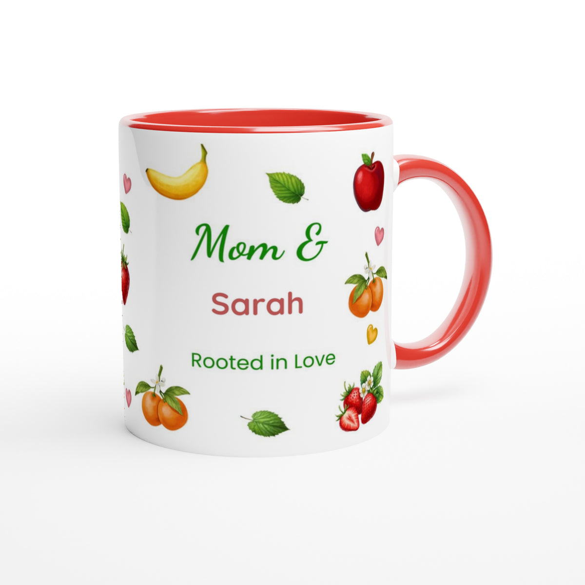 A white ceramic mug with a red interior and red handle, decorated with colorful illustrations of fruits and the personalized text 'Mom & Sarah Rooted in Love'.