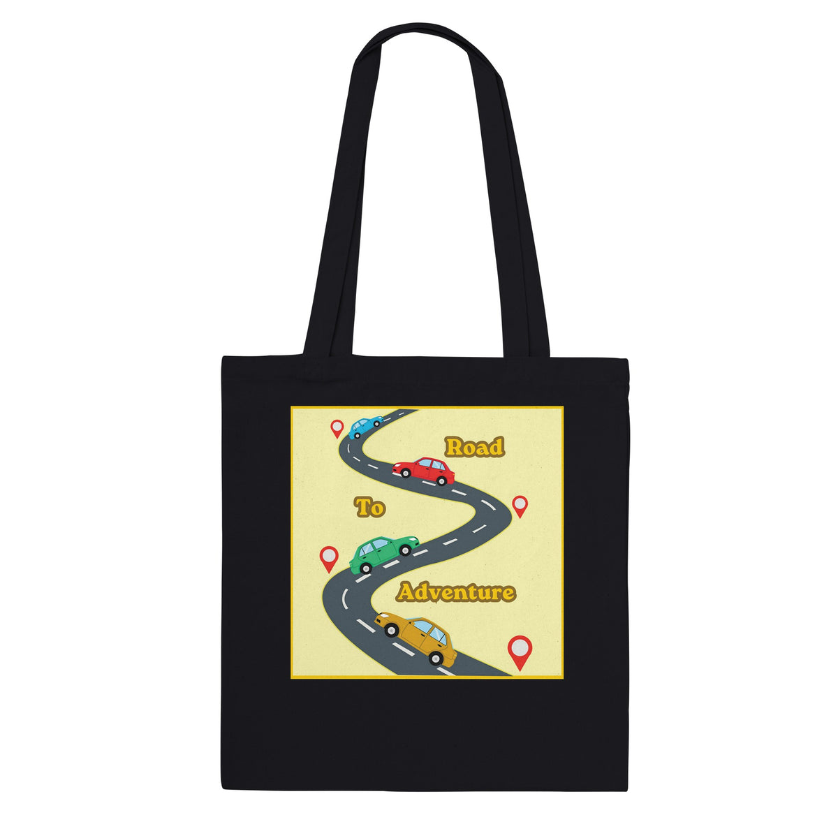 A black canvas tote bag with two shoulder straps, featuring a graphic print on the front. The print shows a winding road labeled 'Road To Inspiration' with three colorful cars (red, green, and yellow) and red map pin markers on a pale yellow background.