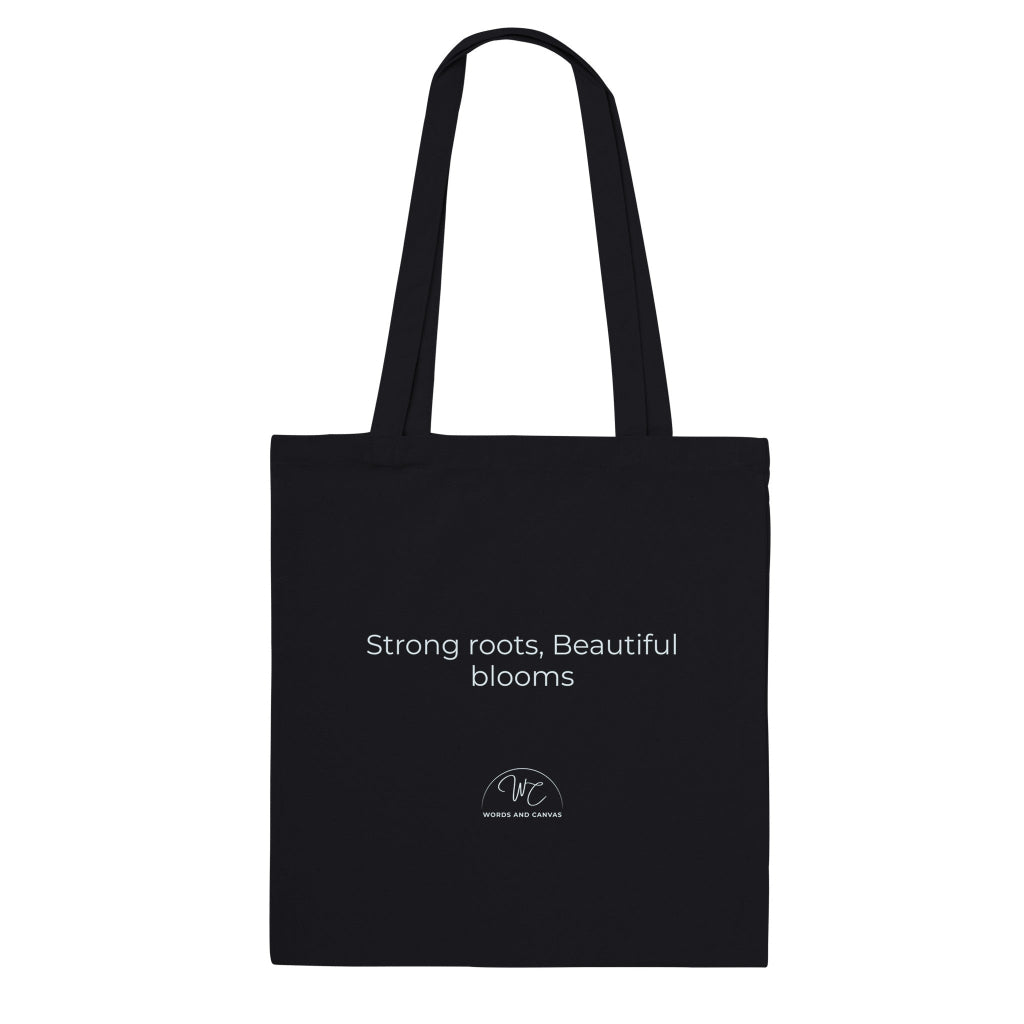 A black canvas tote bag with black printed text and a small circular logo below