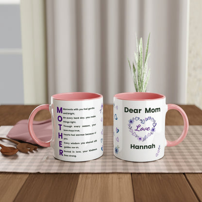 Two personalized ceramic mugs with pink interiors and handles, displayed on a checkered table runner. The left mug is printed with the word 'MOTHER' in large purple letters alongside a short poem.