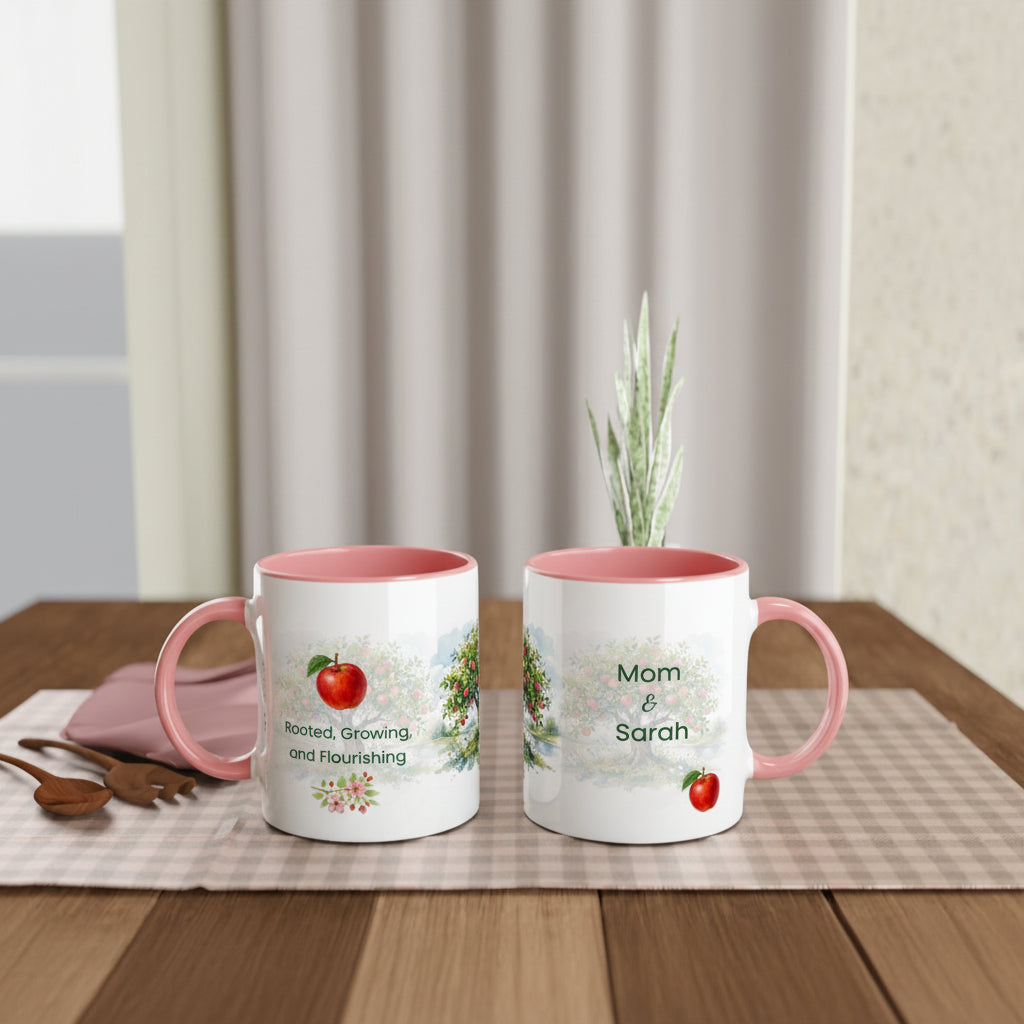 Two personalized white ceramic mugs with pink interiors and handles, displayed on a wooden table 