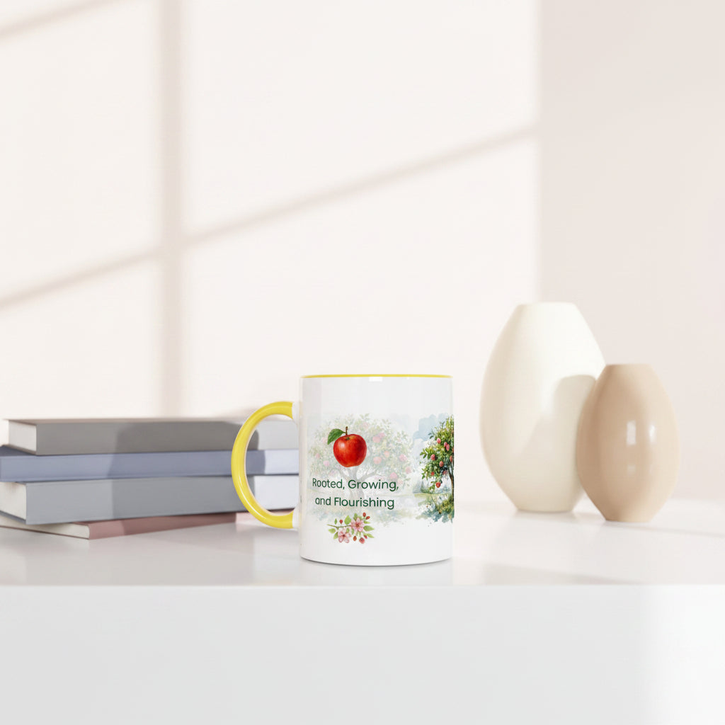 A white ceramic mug with a yellow handle and rim sits on a white tabletop.
