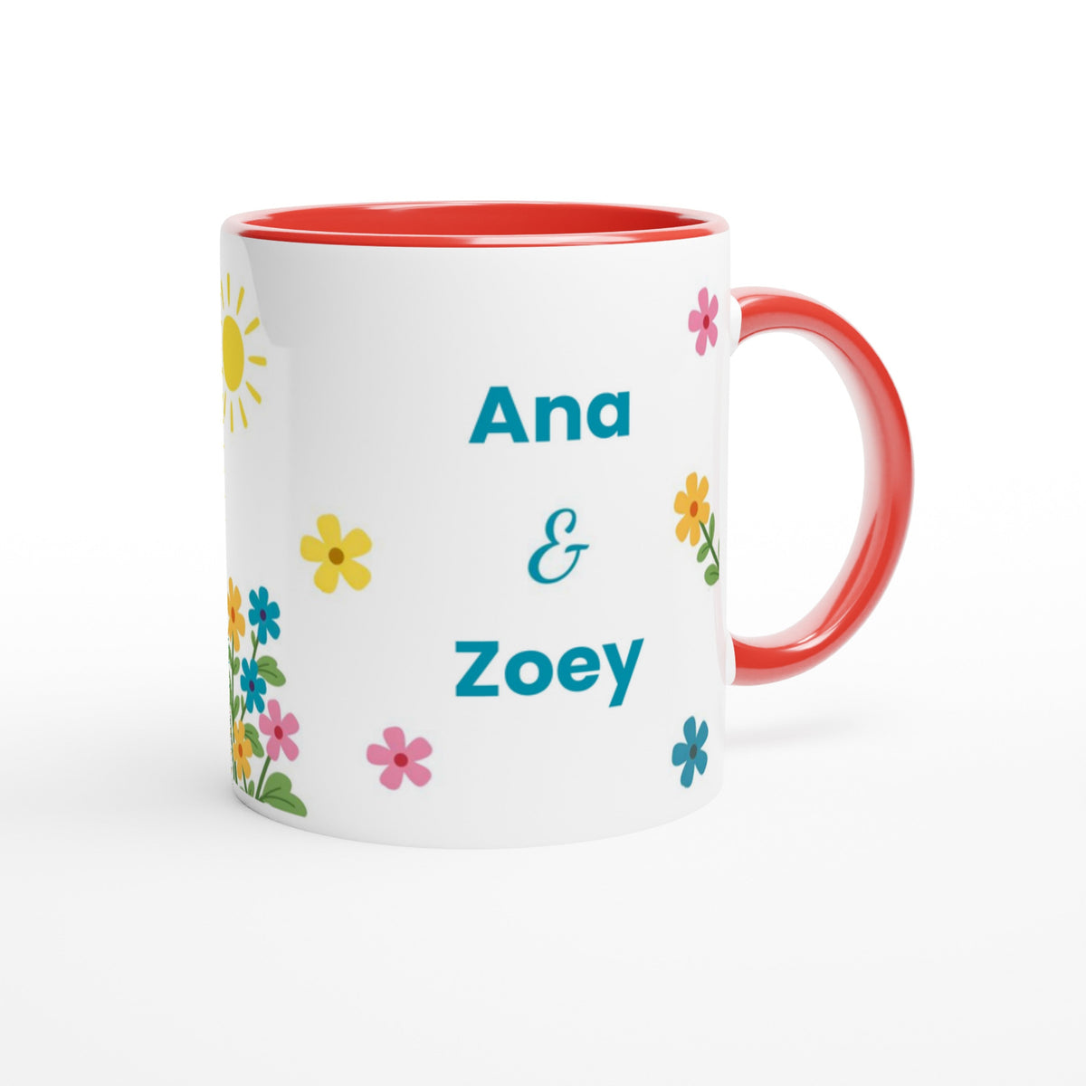 A white ceramic mug with a red interior and red handle, decorated with colorful floral prints and the personalized names 'Ana & Zoey' in teal text.