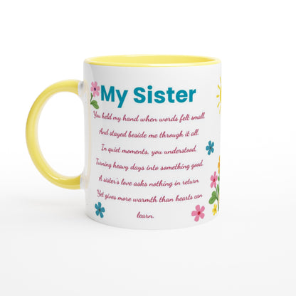 A white ceramic mug with a yellow handle and yellow interior, printed with the text 'My Sister' and a sentimental poem in  pink, decorated with small colorful flowers.
